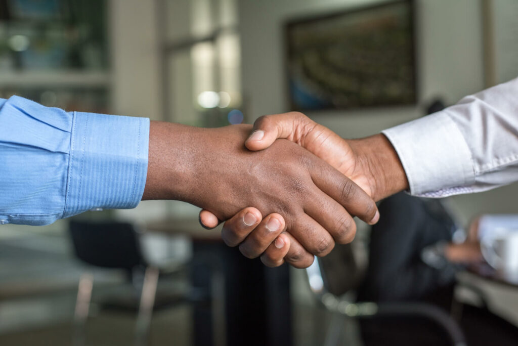 two people shaking hands photo